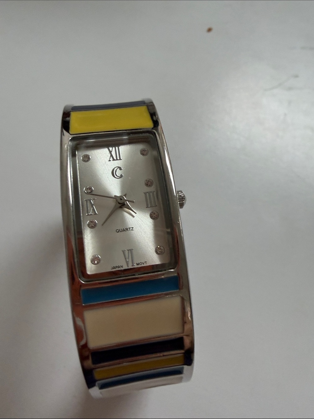 Silver Tone Bangle Watch with Yellow Blue and Cream Inlays needs battery